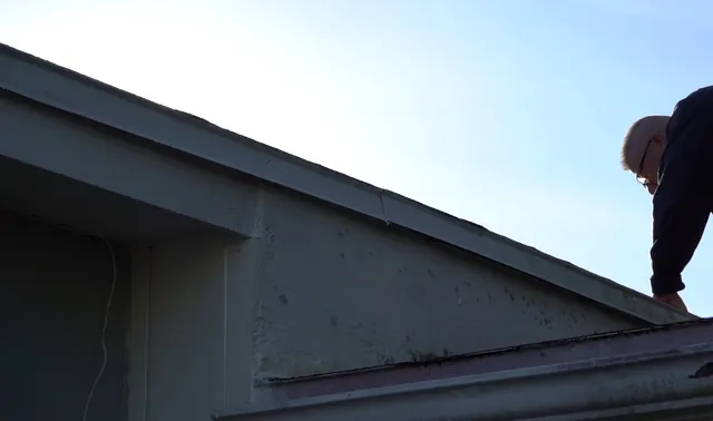 Michael Vecchione on a roof during an inspection