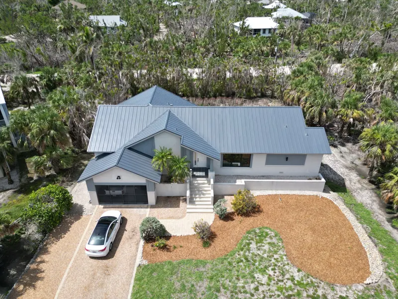 Two-story home with a gray metal roof