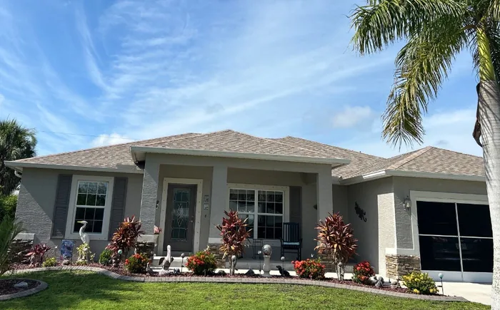 A gray home with a new architectural shingle roof