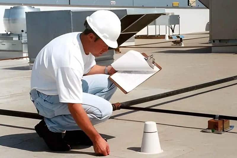 Commercial roof inspection in progress