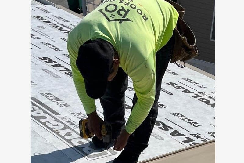 Roofs Only Florida crew installing roof underlayment